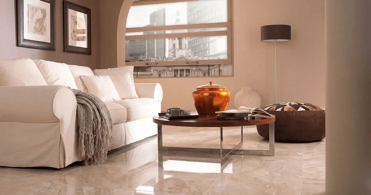 Modern living room with professionally installed marble flooring, a beige sofa, coffee table in Overland Park, KS