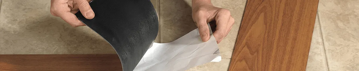 A professional installing vinyl flooring in Overland Park, KS
